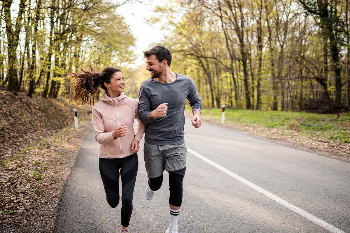 Couple happily jogging while taking GLP-1 in Golden.